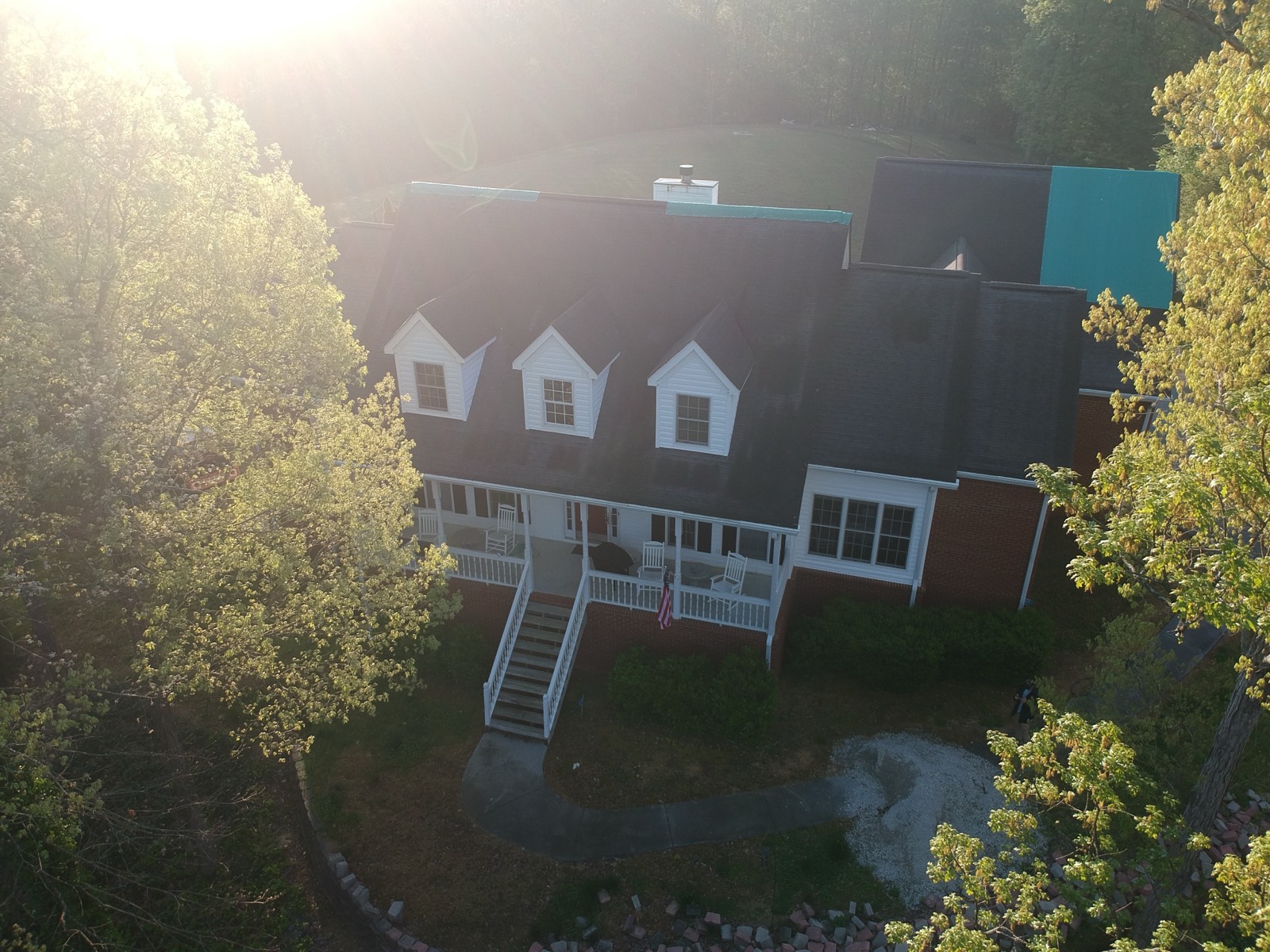 Roof stripped bare after storm damage, before temporary roofing film